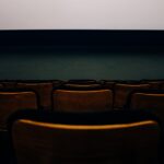 brown chairs in front of white wall